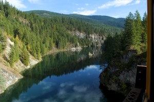 Seen from the Box Canyon trestle bridge, the Pend Oreille River flows north into Canada to join the Columbia River (the Kootenai River in Idaho does the same)