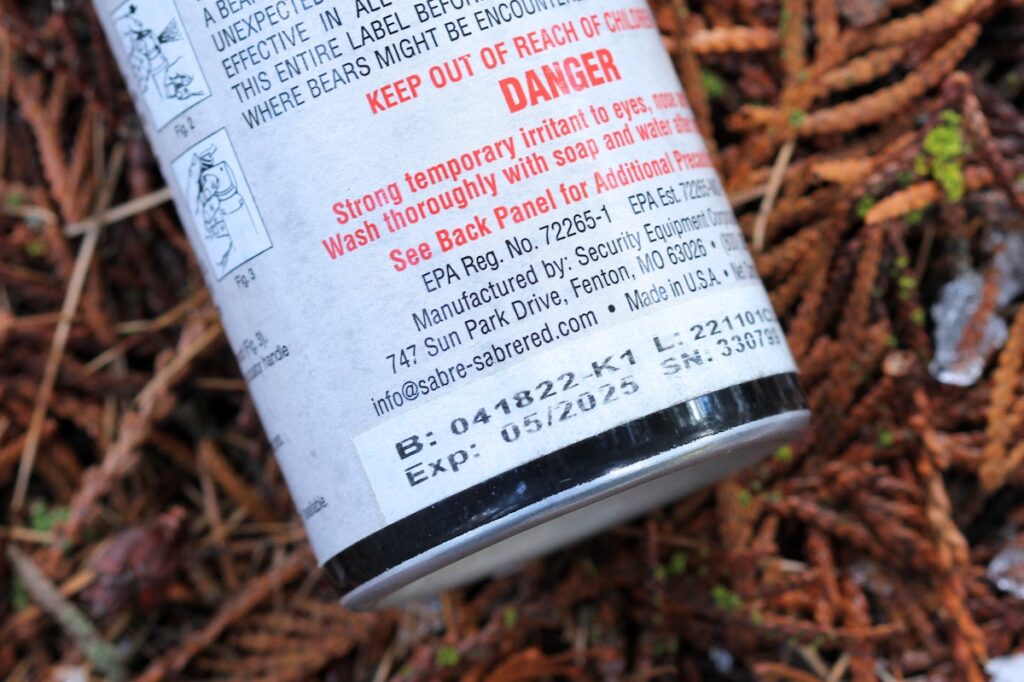 Close-up of expiration date on bear spray canister
